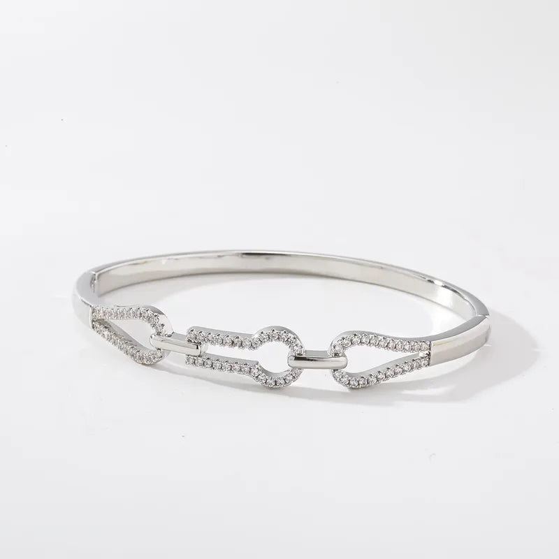 The Nexus Platinum-Tone Zircon Emblem Bangle