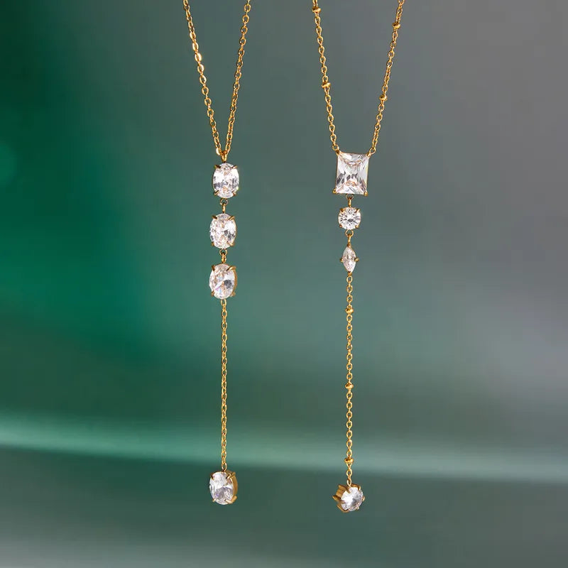 The Aria PVD Gold Linear Crystal Statement Lariat