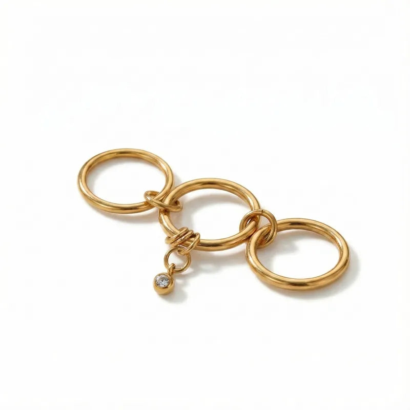 The Interlocking Mixed-Metal 18K Gold Three-Layer Dangle Ring