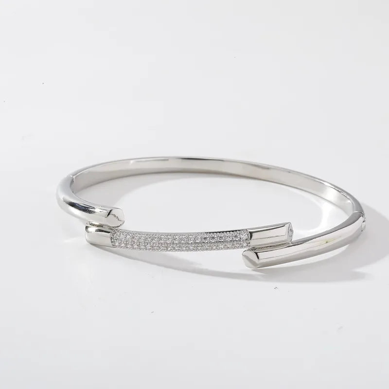 The Nexus Platinum-Tone Zircon Emblem Bangle