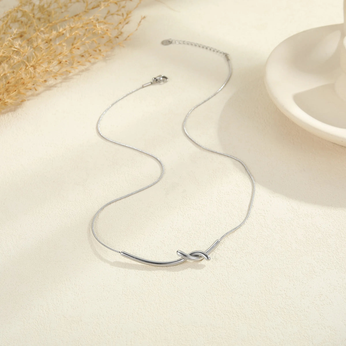 The Elodie Sculpted Infinity Knot Pendant Necklace