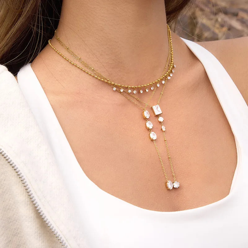 The Aria PVD Gold Linear Crystal Statement Lariat