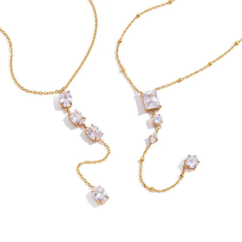 The Aria PVD Gold Linear Crystal Statement Lariat