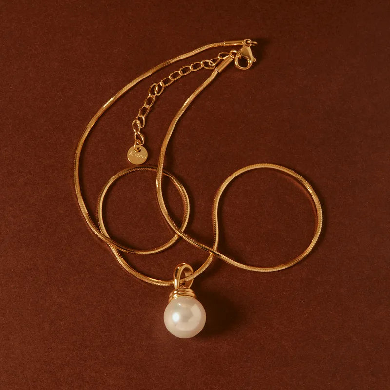 The Celine Liquid Snake Chain Pearl Solitaire Necklace