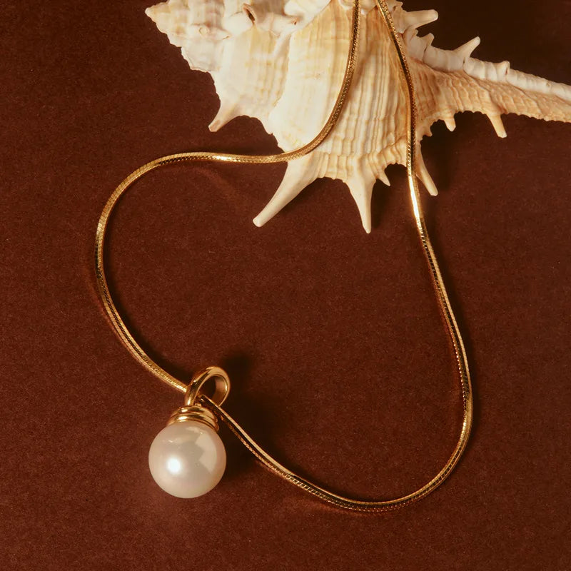 The Celine Liquid Snake Chain Pearl Solitaire Necklace